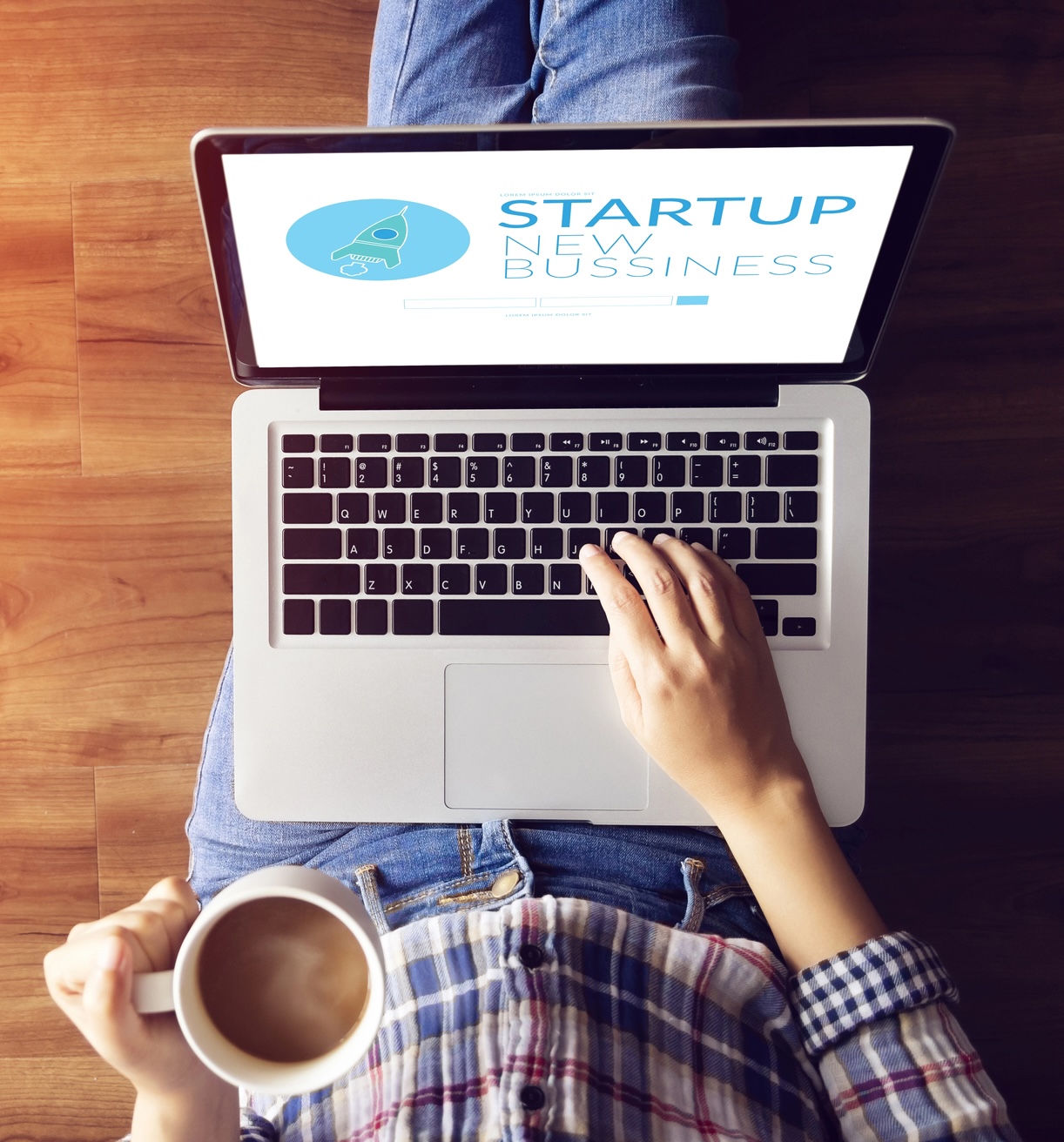 top view of people working on notebook laptop computer from home on wooden floor with startup business and rocket logo on screen, start up ideas business development Starter Website